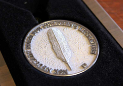 A close-up photo of the NSK medal