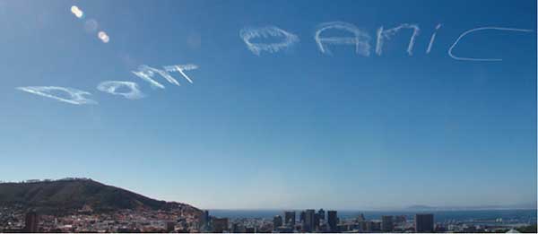 “Don’t Panic,” 2005, by Ruth Sacks. Photographic documentation of skywriting in Cape Town, South Africa.