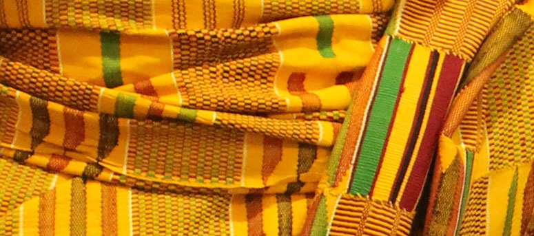 The traditional Ghanian kente cloth that Meshack Asare wore to the 2015 Neustadt Festival ceremony.