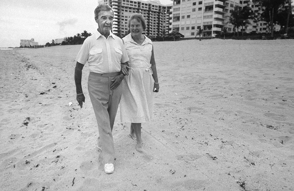Dick Francis and wife, Mary, stroll along the beach in Fort Lauderdale, Florida.