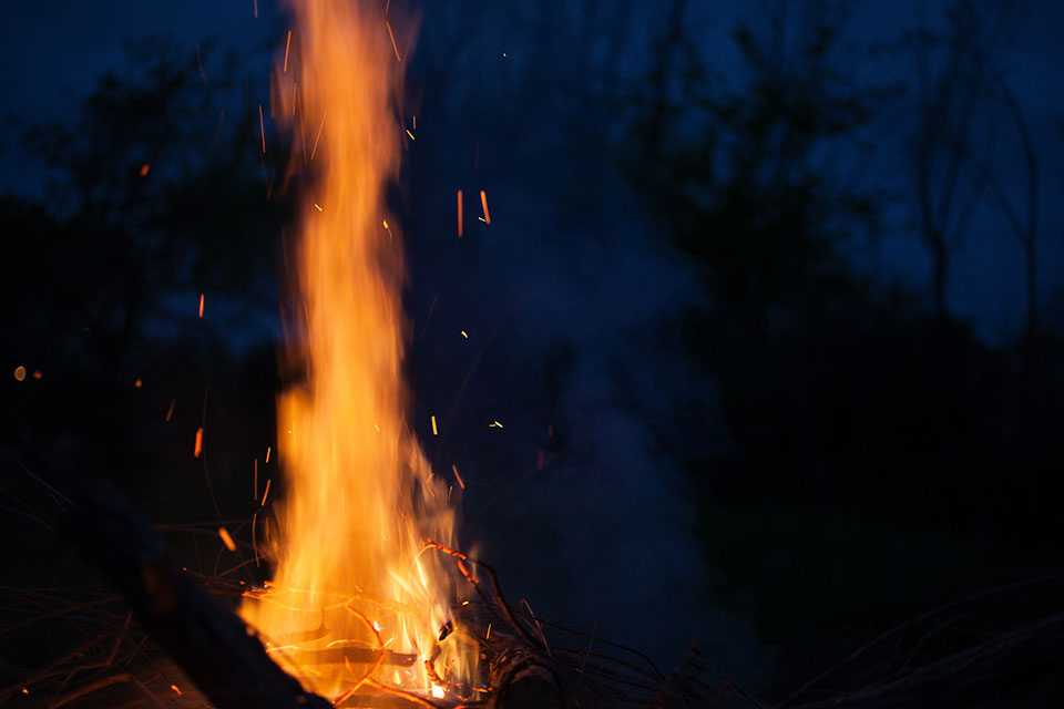 Burning flame from a campfire