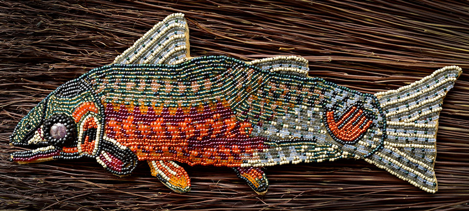 Kim Shuck, Warrior Trout (2016), 15/0 glass seed beads on brain-tanned hide, 9 x 2.5 in / Courtesy of the artist and Doug Salin Photography