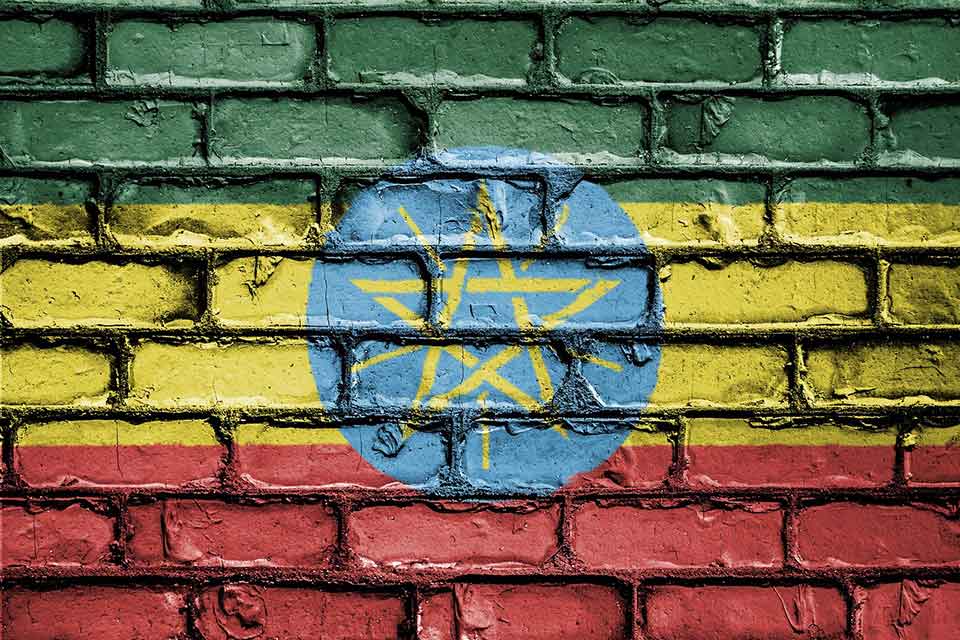 The flag of Ethiopia spray painted on a brick wall
