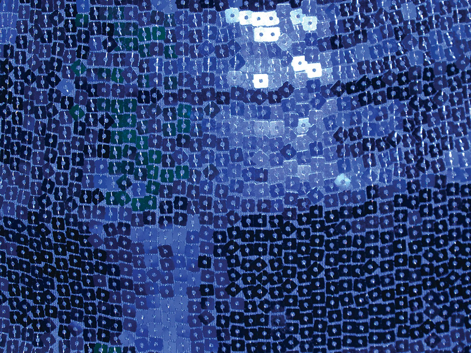 Close-up of the blue sequins on a dress