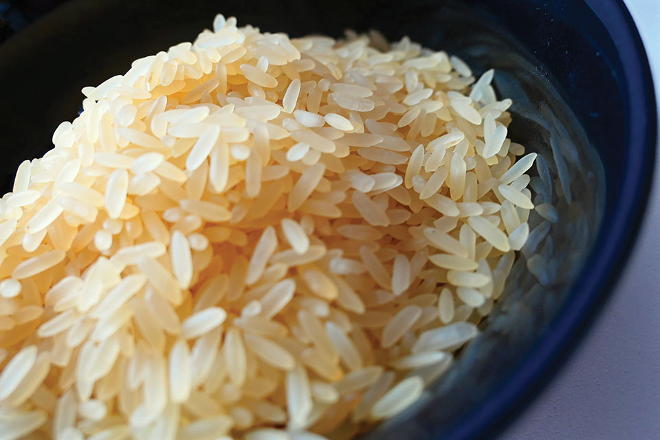 A bowl of rice, lightly colored by an application of soy sauce