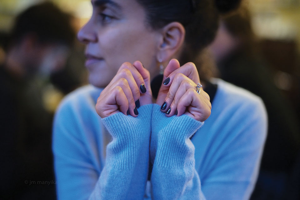 Sarah Ladipo Manyika sits, looking away from the camera, in a blue sweater