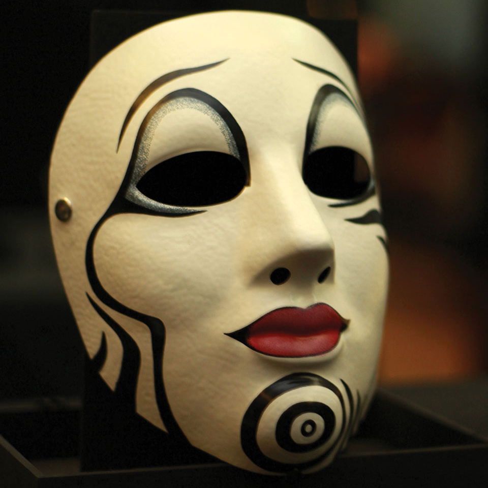 An ornately painted harlequin mask