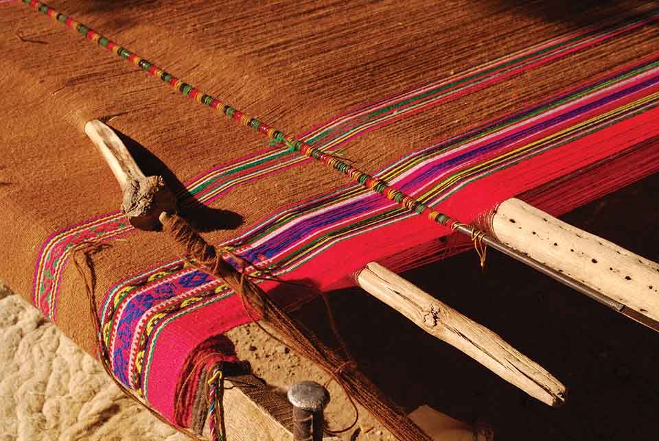 A photograph of a Native weave on a wooden loom