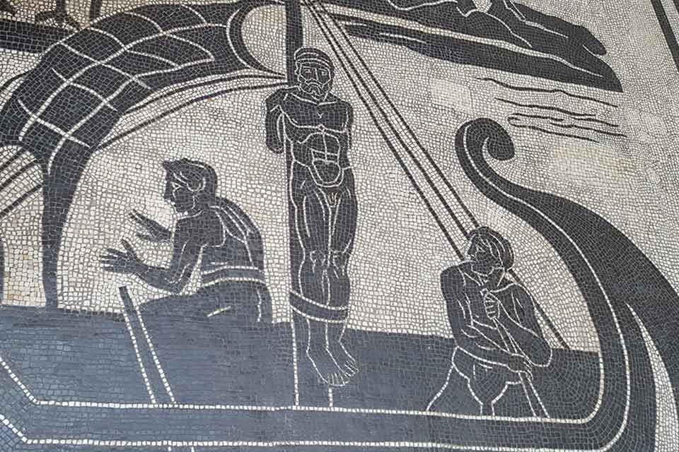A photograph of a mosaic depicting Odysseus bound to the mast of his ship