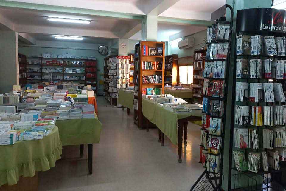 A photograph of the interior of the Cheikh Bookstore in Algeria