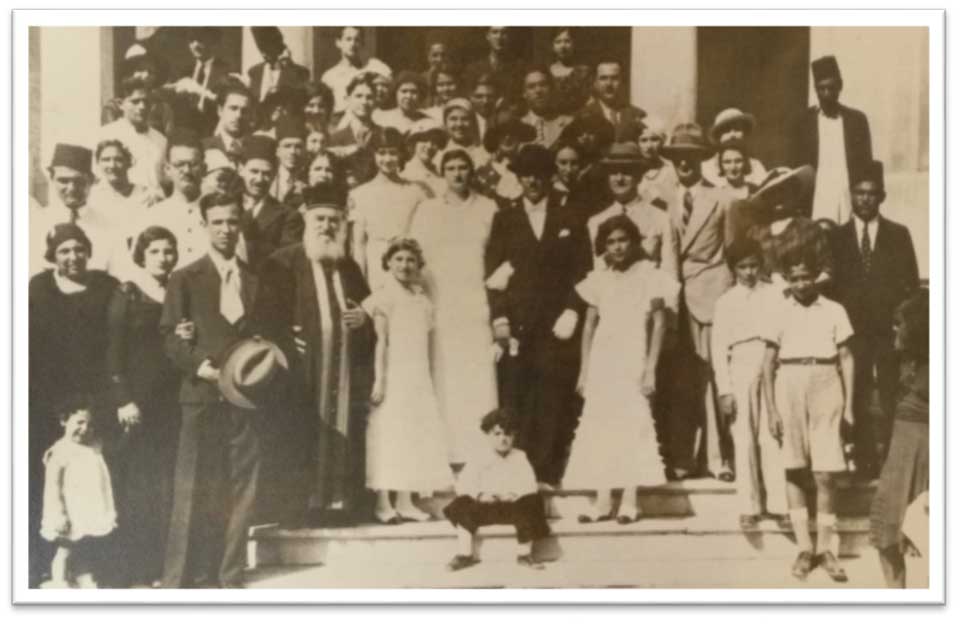 A black and white photograph of a wedding party
