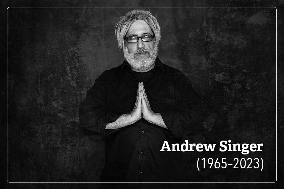 A photograph of Andrew Singer. Text reads: Andrew Singer. 1965-2023.