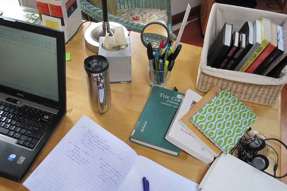 An organized desk with books and papers on it