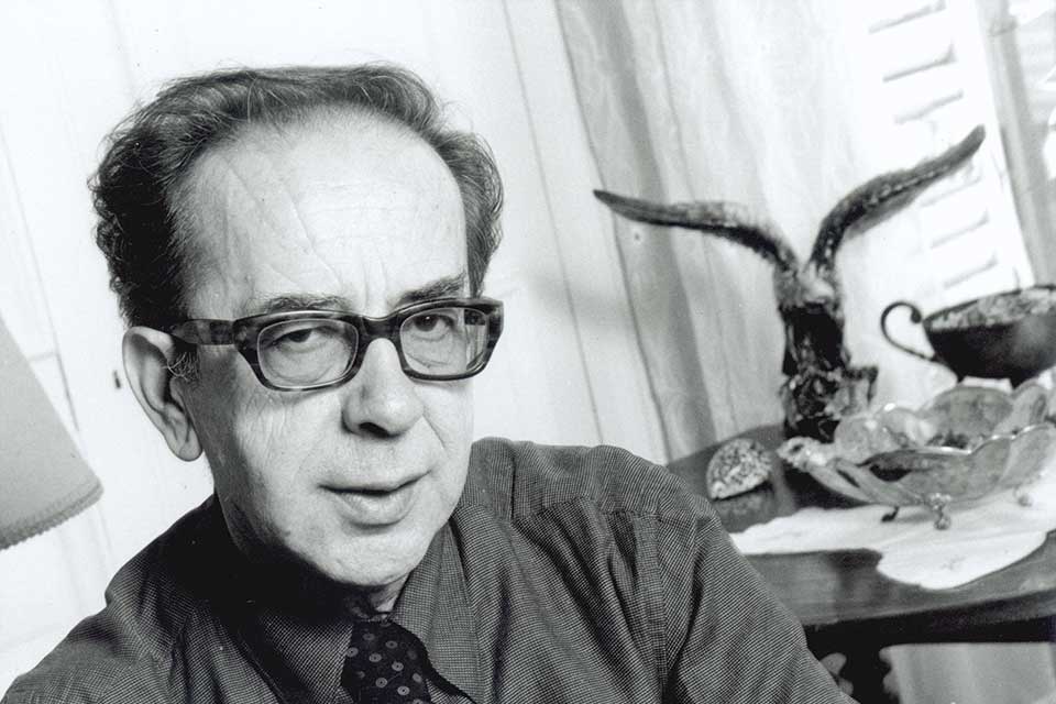 A black and white photograph of Ismail Kadare