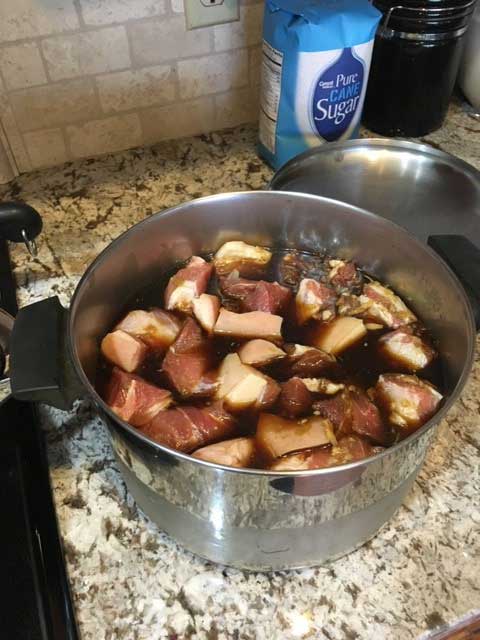 Chunks of pork belly in a pot