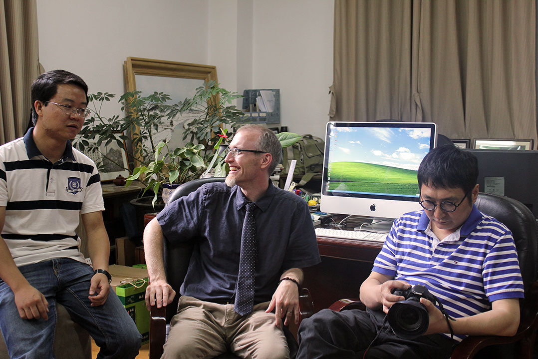 Story consultant Wang Hao (at left) and producer Li Sen (at right) with Jonathan Stalling, deputy editor in chief of CLT, working on the beginning stages of the project in 2011.