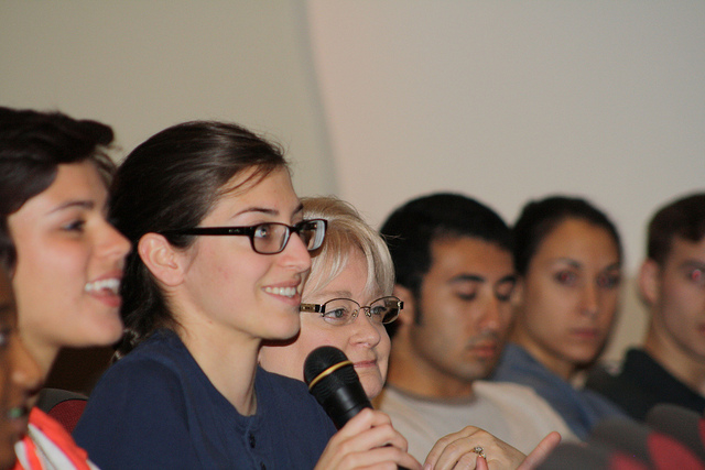 High school student posing a question to the first panel. Photo by Michelle Datin.