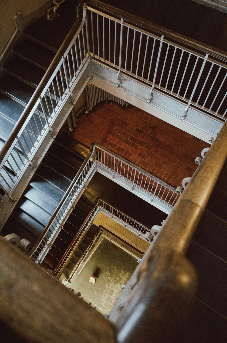 A photograph of a staircase spiraling downward