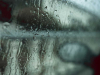 A photograph of a rain-streaked window