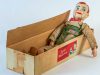 A ventriloquist's dummy in a cardboard box