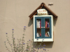 Small outdoor library box with books in English and Spanish