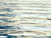A close-up detail of sunlight on a body of water