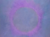 An abstract painting of a circular figure on an aqueous field