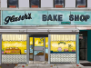 An illustration of a store front. The sign above reads, “Glaser’s Bake Shop”