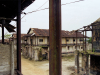 Decrepit buildings stand in an abandoned prison