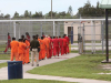 A group of detainees in orange jumpsuits at the Krome Detention Center. Photo: Getty Images