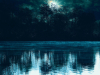 A lake reflecting moonlight at night