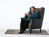 2017 NSK Laureate Marilyn Nelson sits in a chair in front of a stark white background