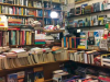 A photograph of the cluttered interior of a bookstore