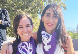 A photograph of Michelle Mirabella and Catalina Infante Beovic taken outdoors at a rally