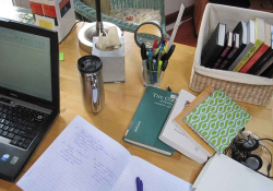 An organized desk with books and papers on it