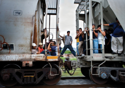 Migrants heading north through Mexico on La Bestia (“The Beast”). 