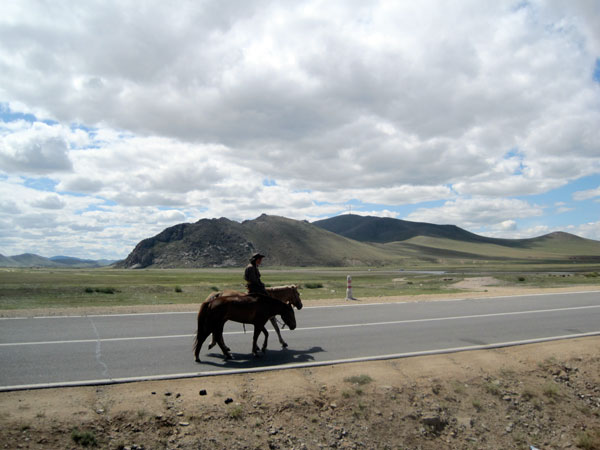 Baagi and two of his horses near Baganuur village.