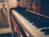 A photograph of a piano keyboard shot from one end