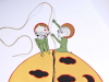 An illustration of two whimsical figures threading a slim rope down a round figure