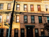 A photograph of an urban apartment building.