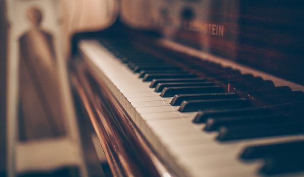 A photograph of a piano keyboard shot from one end