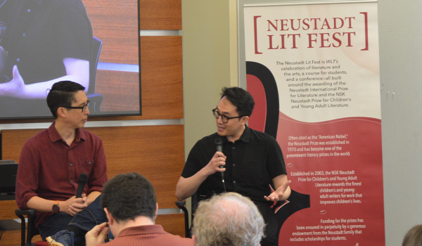 A photograph of Trung Lê Nguyễn and Gene Luen Yang talking at the 2023 Neustadt Lit Fest