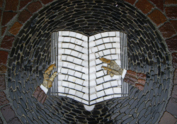 Table with mosaic design of a book