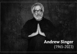 A photograph of Andrew Singer. Text reads: Andrew Singer. 1965-2023.
