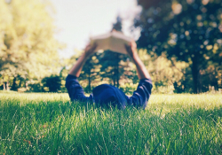 Person reading in the grass