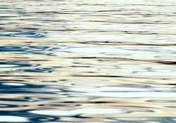 A close-up detail of sunlight on a body of water