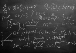A photograph of a blackboard with mathematical equations on it in chalk