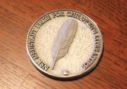 A photograph of the NSK Laureate's medallion