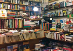 A photograph of the cluttered interior of a bookstore